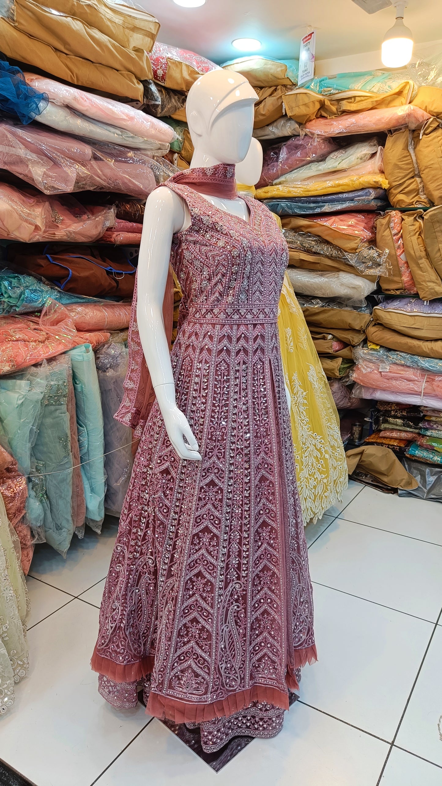 "Pink Petal Perfection: Net Gown Elegance from Tanu Shop India"